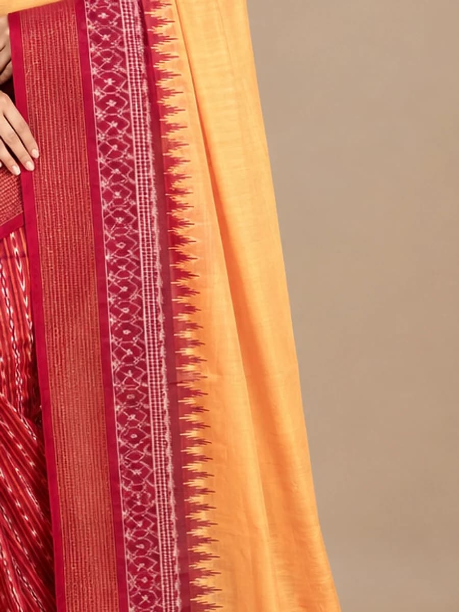 Close-up of a crimson temple border and saffron handloom drape, Handloom Garden Puri