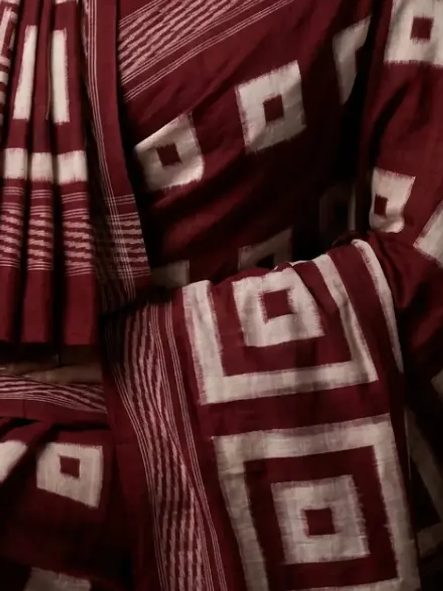 Close-up of maroon and white handwoven geometric ikat, Handloom Garden Puri